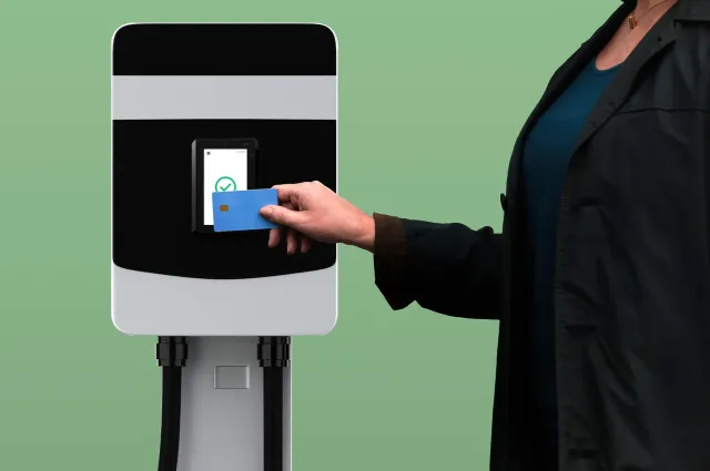 Woman paying at EV charging station